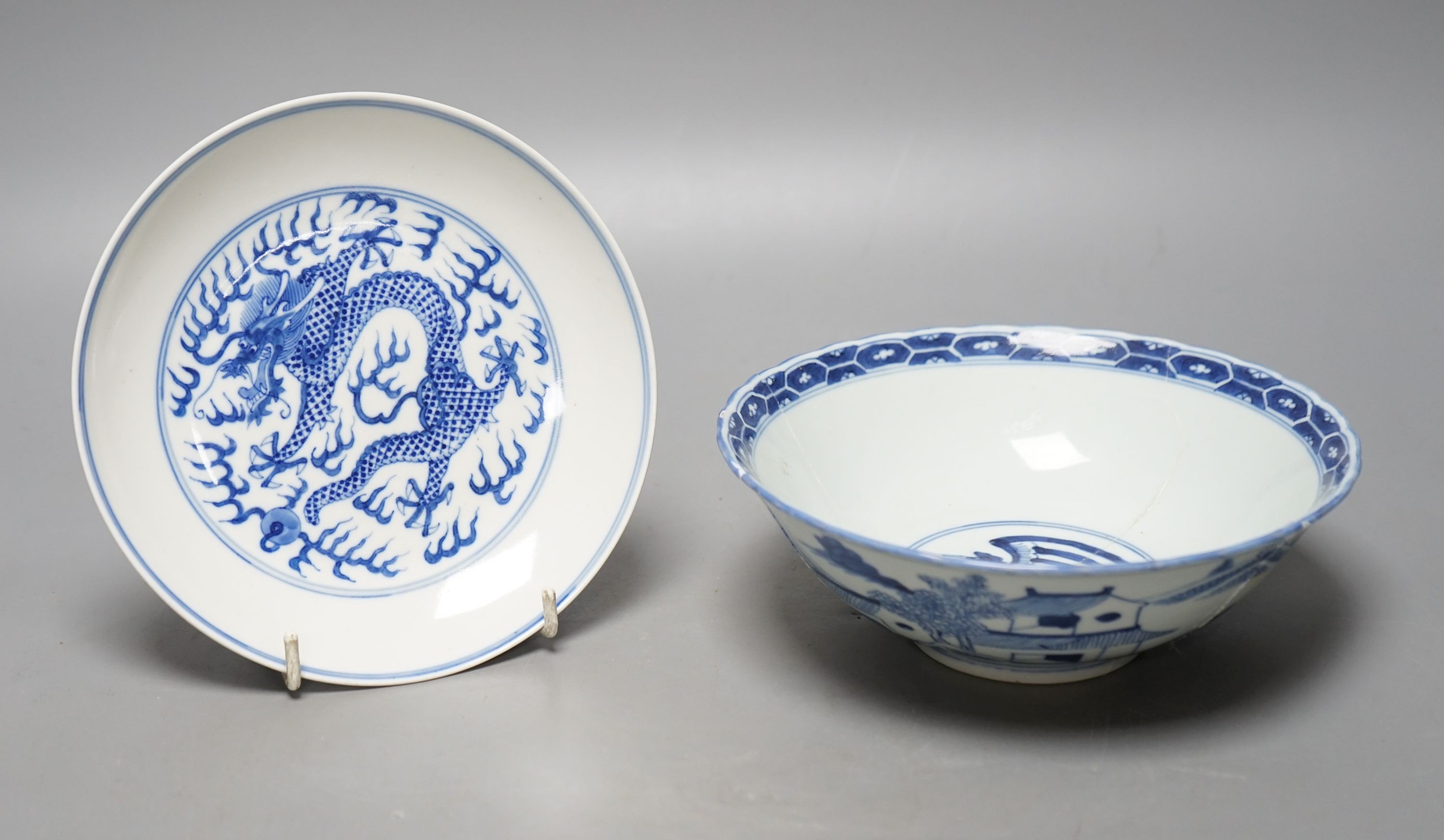 A Chinese blue and white landscape bowl, a/f and a Chinese blue and white 'dragon' dish, 18cm and 16.5cm